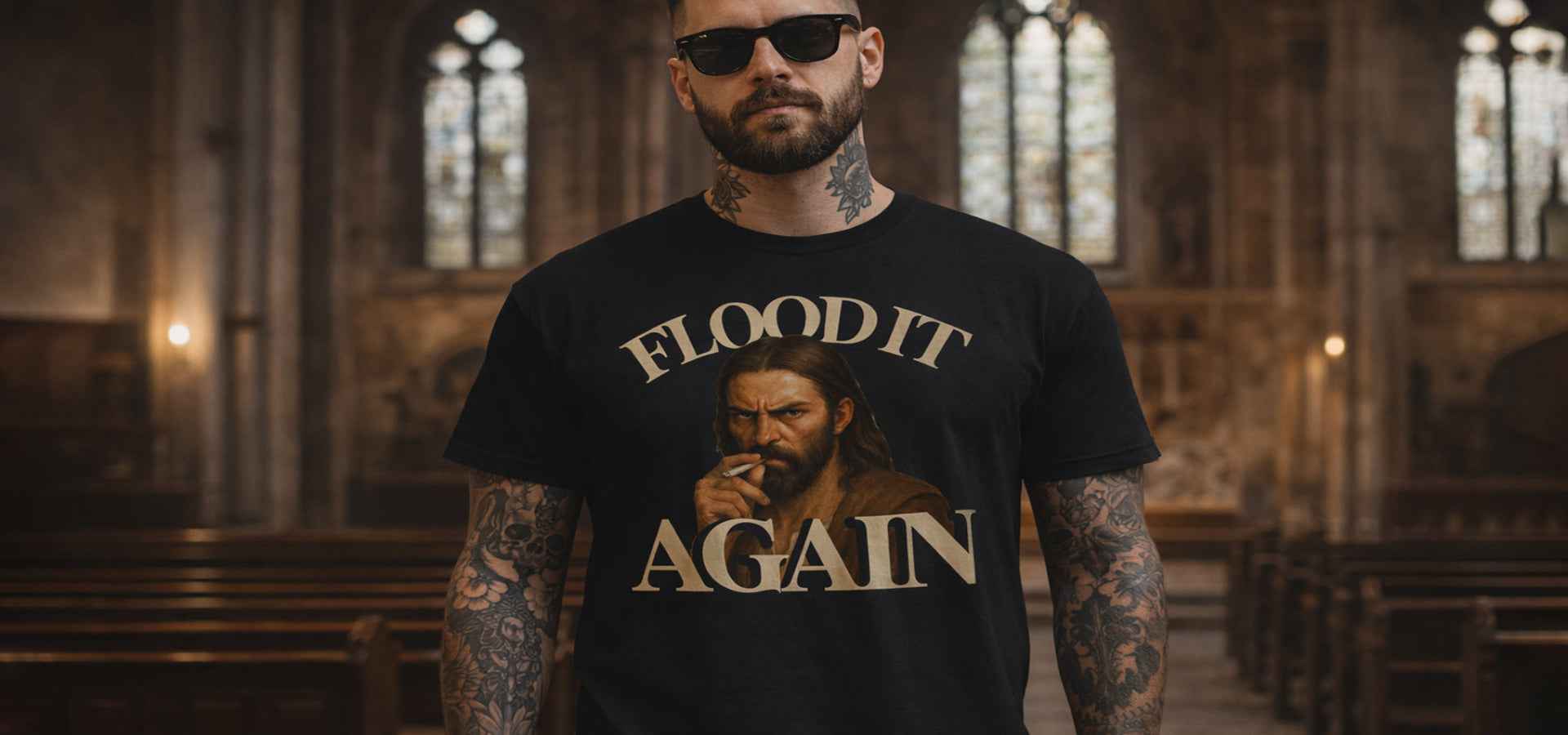 Man wearing a black t-shirt with graphic design and text in a church setting