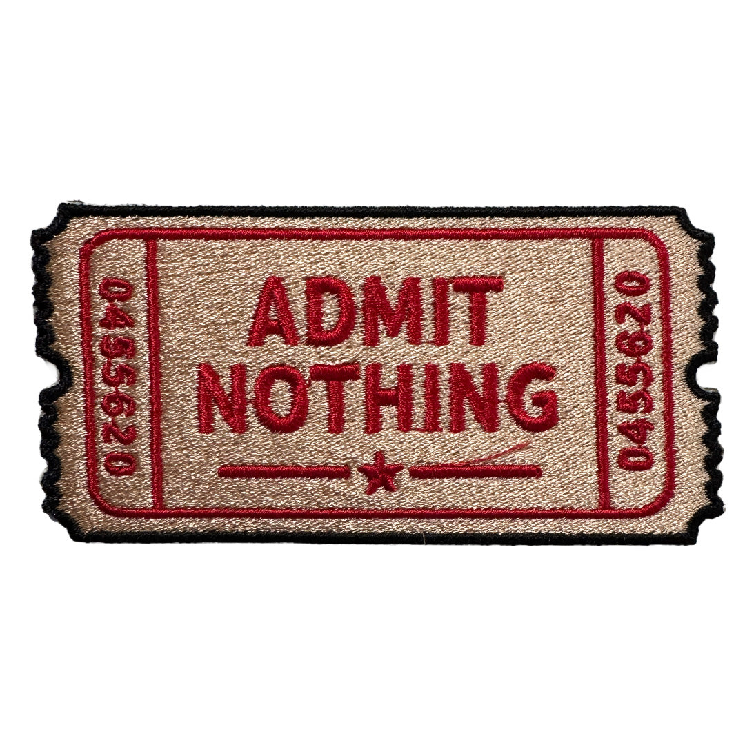 Embroidered patch of a 'Admit Nothing' ticket on a white background