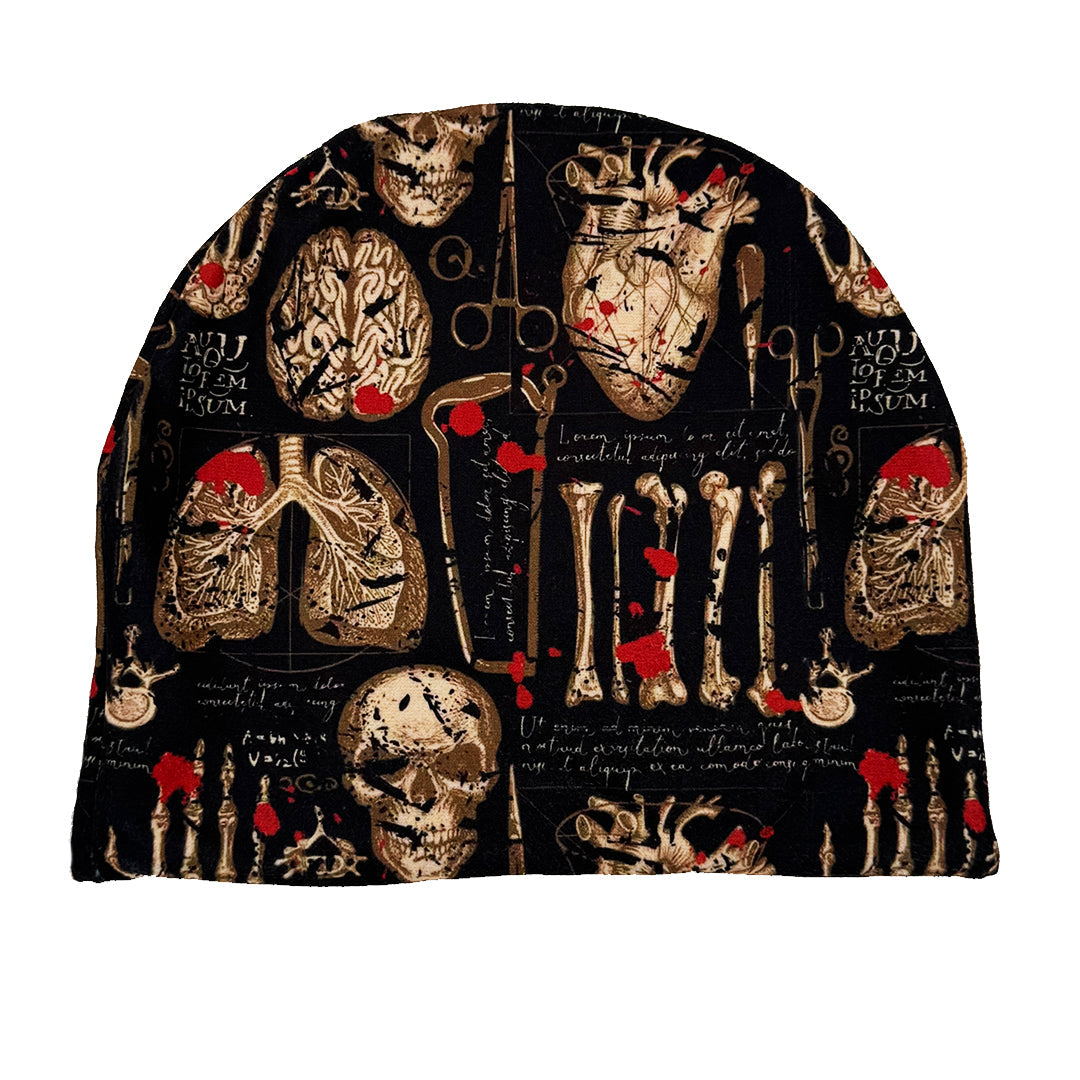 Hoodie with anatomical design featuring skulls, bones, and medical tools on a black background.